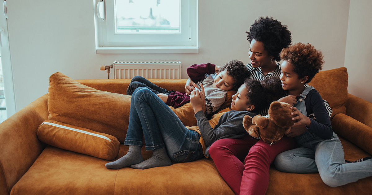 family on couch in home