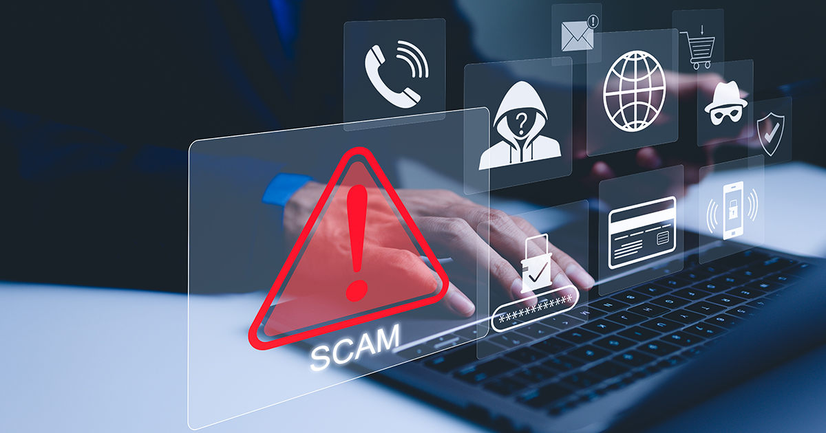 scams icons around person on laptop