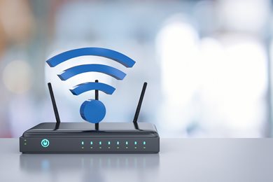 Internet router and Wi-Fi symbol on desk
