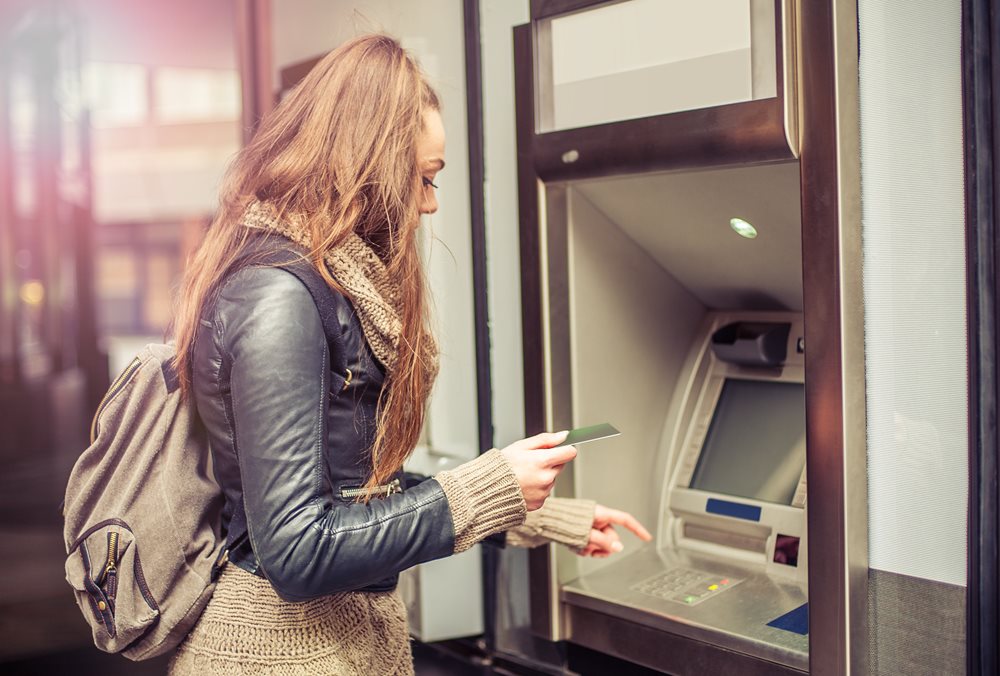 female using the atm