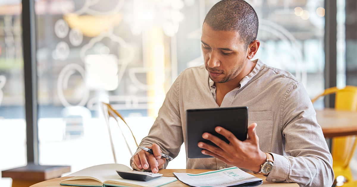 person reviewing finances at table