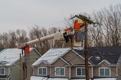electric company working on power lines after a winter storm